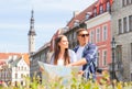 Couple of tourists traveling and exploring beautiful old town together. Loving man and woman in a vacation trip. Royalty Free Stock Photo