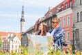 Couple of tourists traveling and exploring beautiful old town together. Loving man and woman in a vacation trip. Royalty Free Stock Photo