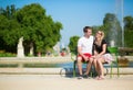 Couple of tourists in the Tuileries garden Royalty Free Stock Photo