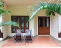 Couple of Traditional Wooden Deck Chairs on Patio of Balcony or Terrace in Open Area in front of Windows and Doors for Relax Royalty Free Stock Photo