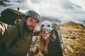 Couple travel selfie man and woman hiking in mountains