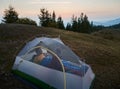 Camping on mountain hill in summer morning.