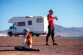 Couple traveling by camping trailer Royalty Free Stock Photo