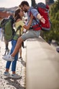 Couple traveling at vacation and  adventure. man and woman  on bridge at Prague kissing Royalty Free Stock Photo