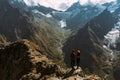 The couple travels through the Caucasus mountains. Man and woman traveling. A walk in the mountains. Royalty Free Stock Photo