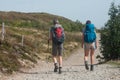 Couple of trekkers walking at the top with backpack