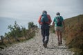 Couple of trekkers walking at the top with backpack