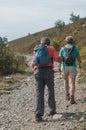 Couple of trekkers walking at the top with backpack