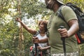 Couple trekking in the forest together Royalty Free Stock Photo