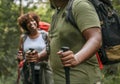 Couple trekking in the forest together Royalty Free Stock Photo