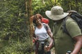 Couple trekking in the forest together Royalty Free Stock Photo