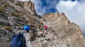 Couple trekking on mystical hiking trail leading to Mount Olympus Mytikas, Skala, Stefani in Mt Olympus National Park