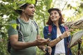 Couple trekking together in a forest Royalty Free Stock Photo