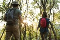 Couple trekking together in a forest Royalty Free Stock Photo