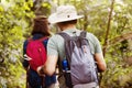 Couple trekking together into the forest Royalty Free Stock Photo