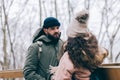 Couple trekking in winter in the forest.