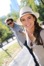 Couple of trendy tourists having fun in central park Royalty Free Stock Photo