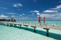 Couple on a beach jetty at Maldives Royalty Free Stock Photo