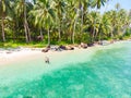 Couple on tropical beach at Tailana Banyak Islands Sumatra tropical archipelago Indonesia, Aceh, coral reef white sand beach