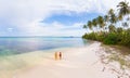 Couple on tropical beach at Tailana Banyak Islands Sumatra tropical archipelago Indonesia, Aceh, coral reef white sand beach Royalty Free Stock Photo