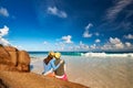 Couple at tropical beach wearing rash guard