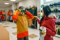 Couple trying on mask for ski or snowboarding Royalty Free Stock Photo