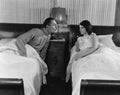 Couple in twin beds Royalty Free Stock Photo