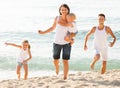 Couple with two children running Royalty Free Stock Photo
