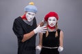 Couple of two funny mimes isolated on background