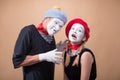 Couple of two funny mimes isolated on background Royalty Free Stock Photo