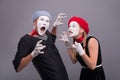 Couple of two funny mimes isolated on background Royalty Free Stock Photo