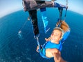 couple of two happy people enjoying summer and vacations doing extreme activity on the sea with a boat - beautiful people taking a Royalty Free Stock Photo