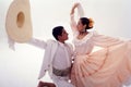 couple of typical dance of Peru, the sailor of trujillo chalan with a hat and a woman with scarves in her hand on a white