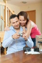 Couple unpacking new compact digital camera Royalty Free Stock Photo