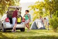 Couple unpacking things for camping trip Royalty Free Stock Photo