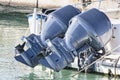 Couple of used blue outboard engines mounted on a speedboat
