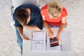 Couple Using Calculator For Calculating Invoice Royalty Free Stock Photo