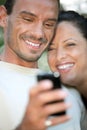 Couple using a cameraphone Royalty Free Stock Photo