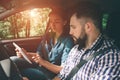 Couple using gps on tablet compter to navigate in car on holiday Royalty Free Stock Photo