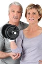 Couple using gym weights Royalty Free Stock Photo