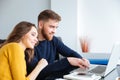 Couple using laptop computer at home Royalty Free Stock Photo