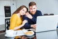 Couple using laptop computer at home Royalty Free Stock Photo