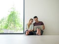 Couple using laptop on the floor at home Royalty Free Stock Photo