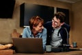 Couple using a laptop at home Royalty Free Stock Photo