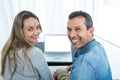 Couple using laptop in living room Royalty Free Stock Photo