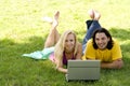 Couple using laptop outdoors Royalty Free Stock Photo