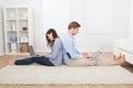 Couple using laptops in living room Royalty Free Stock Photo