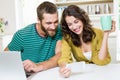 Couple using mobile phone while having coffee Royalty Free Stock Photo