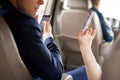 Couple using moblie phone in a car Royalty Free Stock Photo