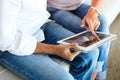 Couple using a tablet computer in their living room Royalty Free Stock Photo